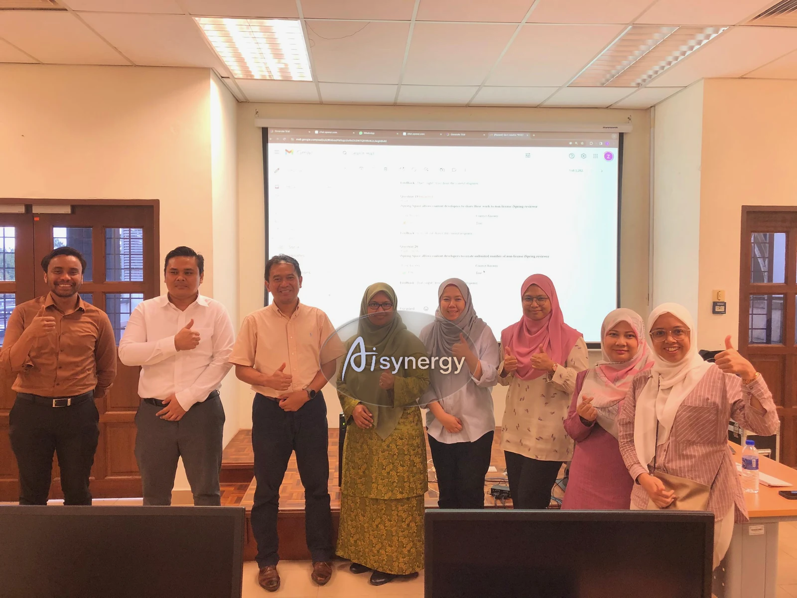 A group of training participants posing together after a completed session