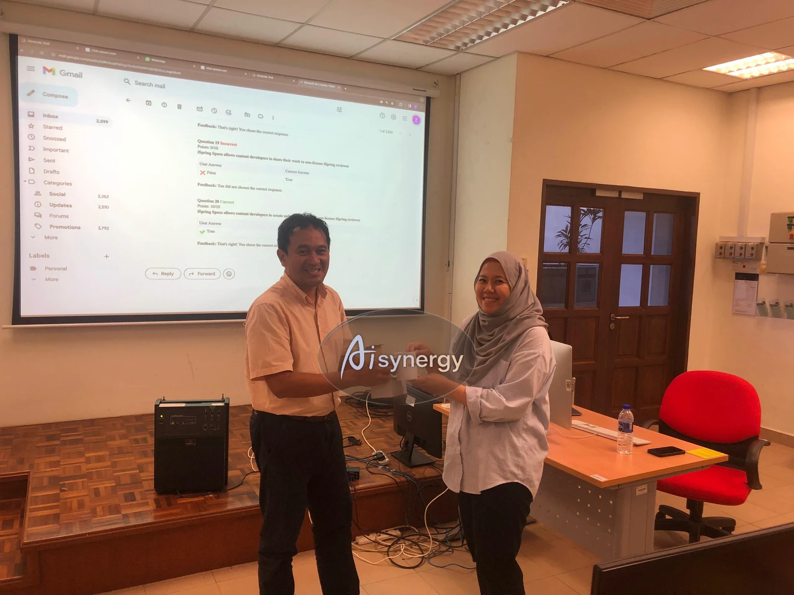 Trainer and participant reviewing a completed course quiz together at the end of a session