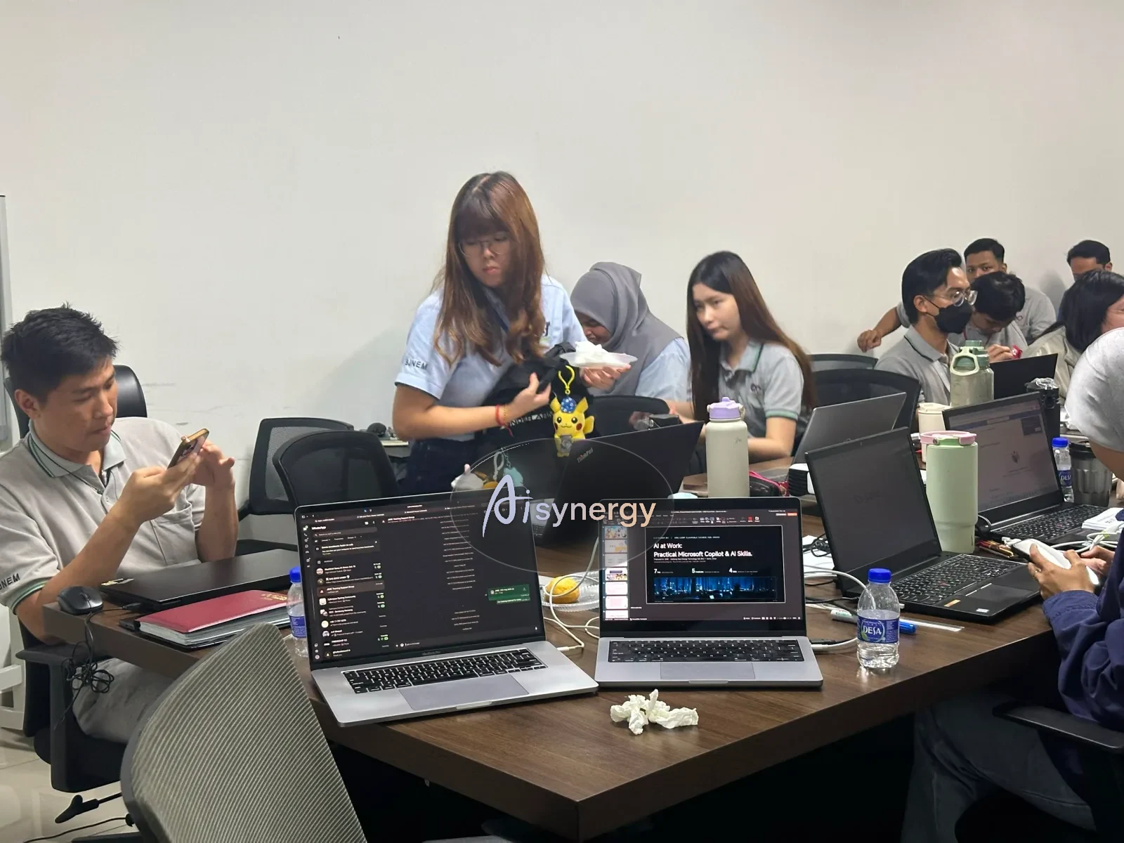 Participants working on laptops during a training session
