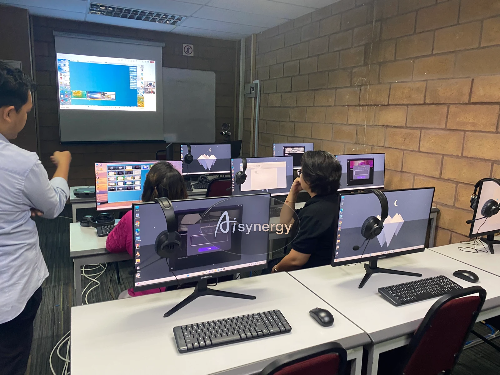 Trainer reviewing a participant’s build on screen during a hands-on session